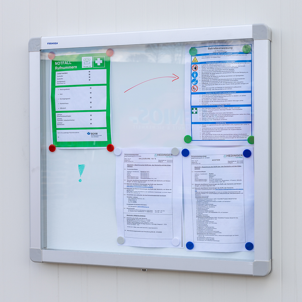 Info board with information in a DENIOS hazardous materials warehouse